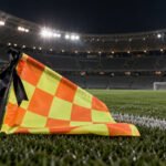 Bandeira de árbitro assistente com laço preto em homenagem póstuma